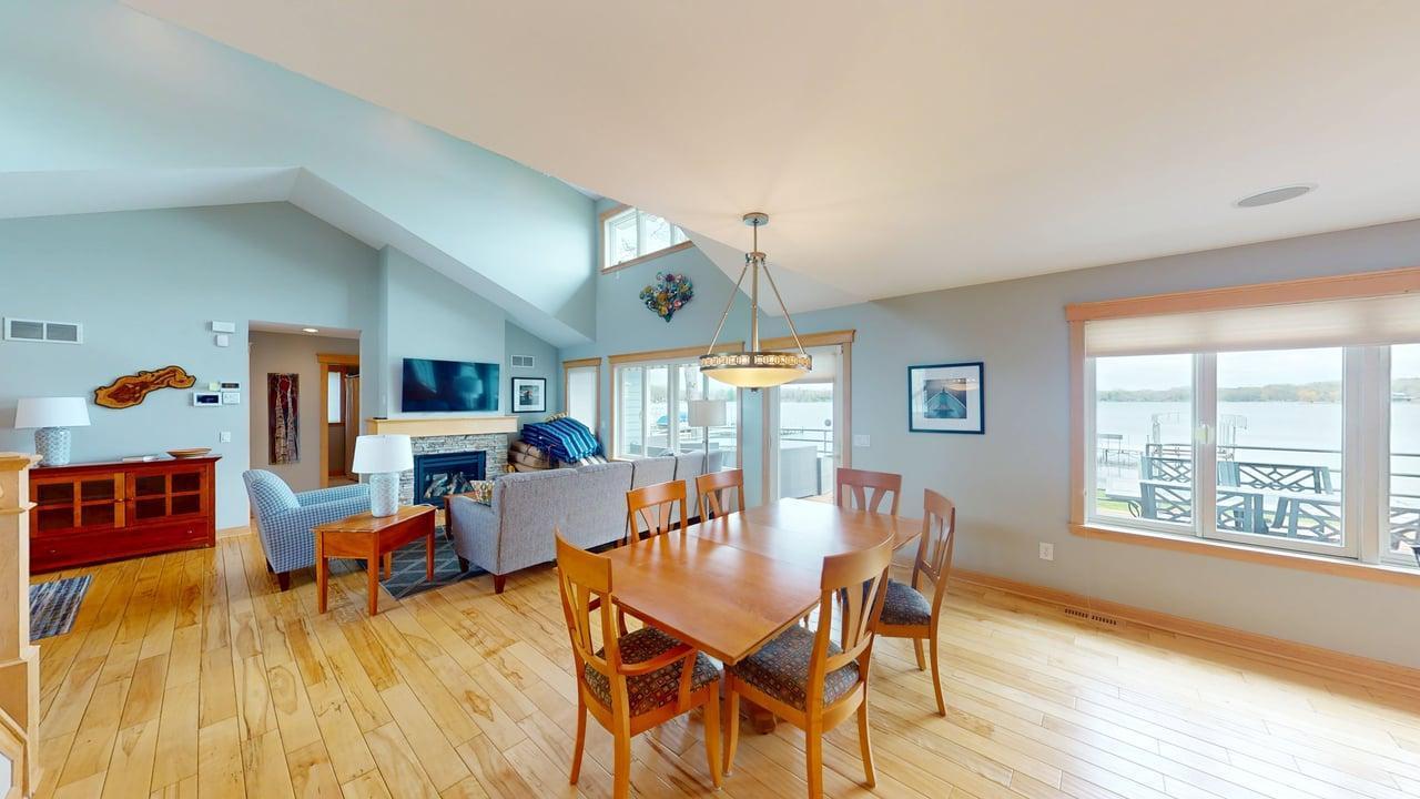 Expansive lakeside windows fill the home with natural light and bring the beauty of the lake indoors.