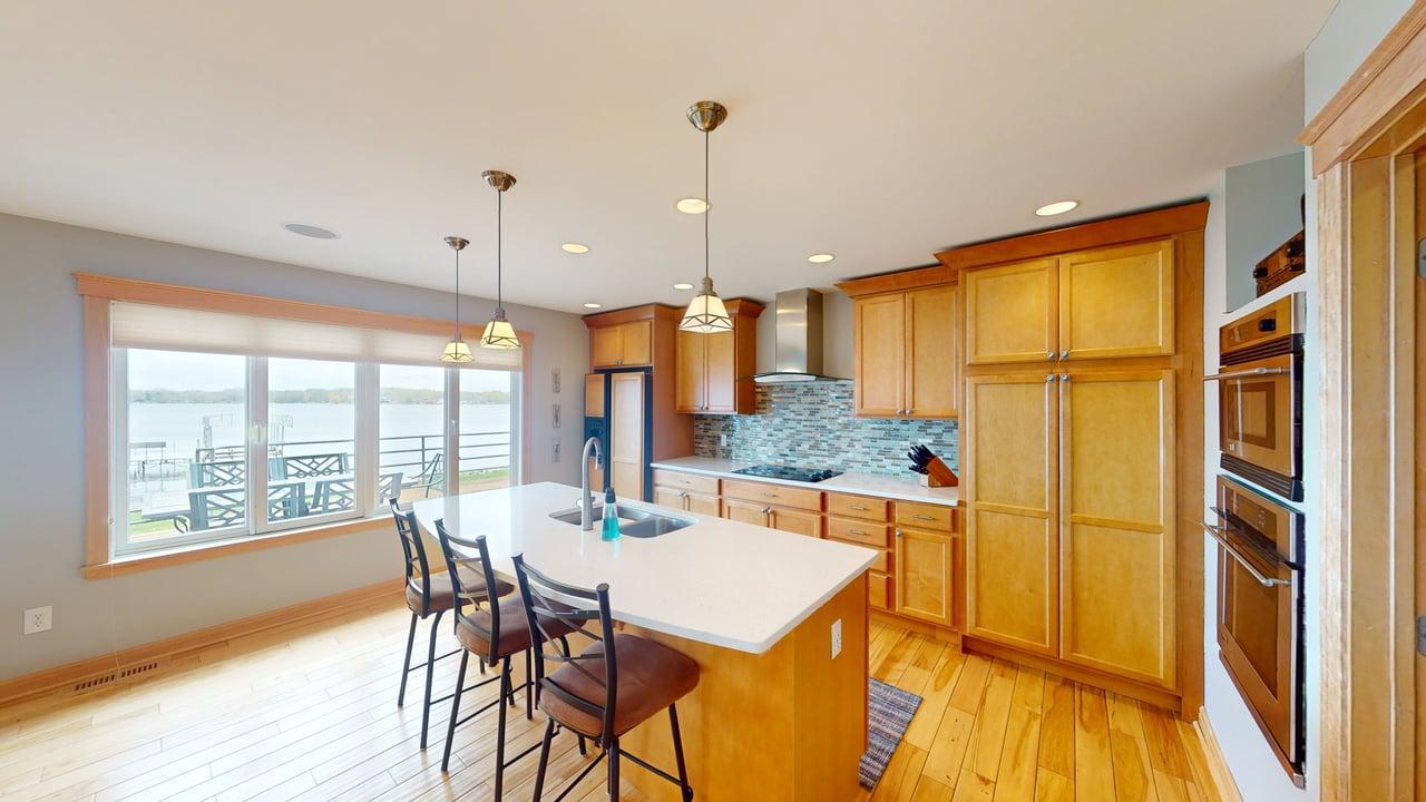 Stay connected to the conversation while entertaining in this kitchen, featuring a center island that’s perfect for extra seating.