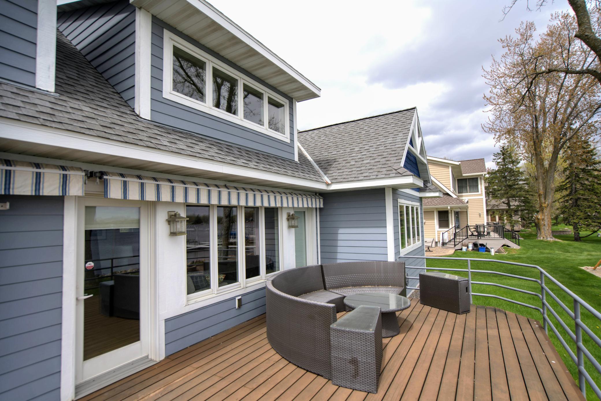 Spacious deck with plenty of room to grill, relax, and entertain—the perfect spot to unwind while enjoying beautiful views of Sugar Lake.