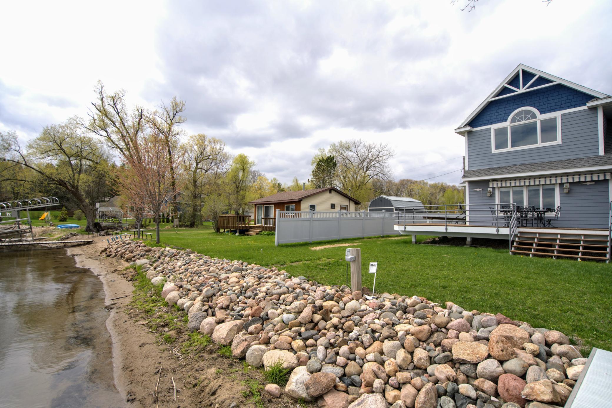 The spacious lakeside green area is ideal for outdoor games and activities.