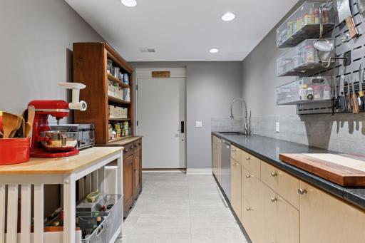 Prep kitchen gives access to the exterior kitchen and beautiful views.