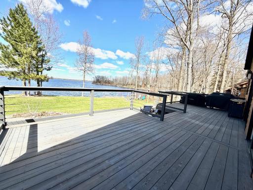 Freshly stained deck and new wire railing