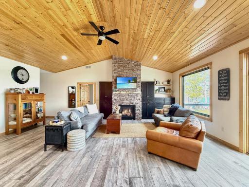 Vaulted pine covered ceilings, stone covered gas fireplace, knock down ceilings