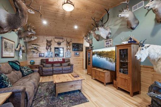 Family room with LVP flooring and pine covered ceilings