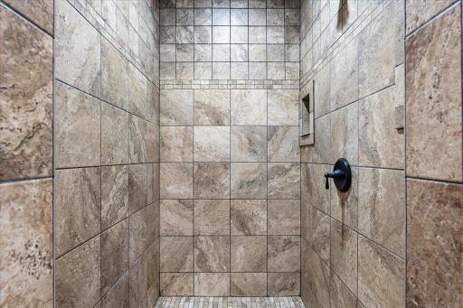Tile shower stall in the private owners bath