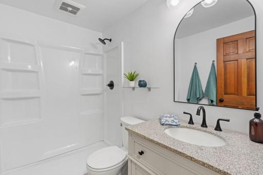 Lower level 3/4 bathroom - shower door to be install prior to closing.jpg