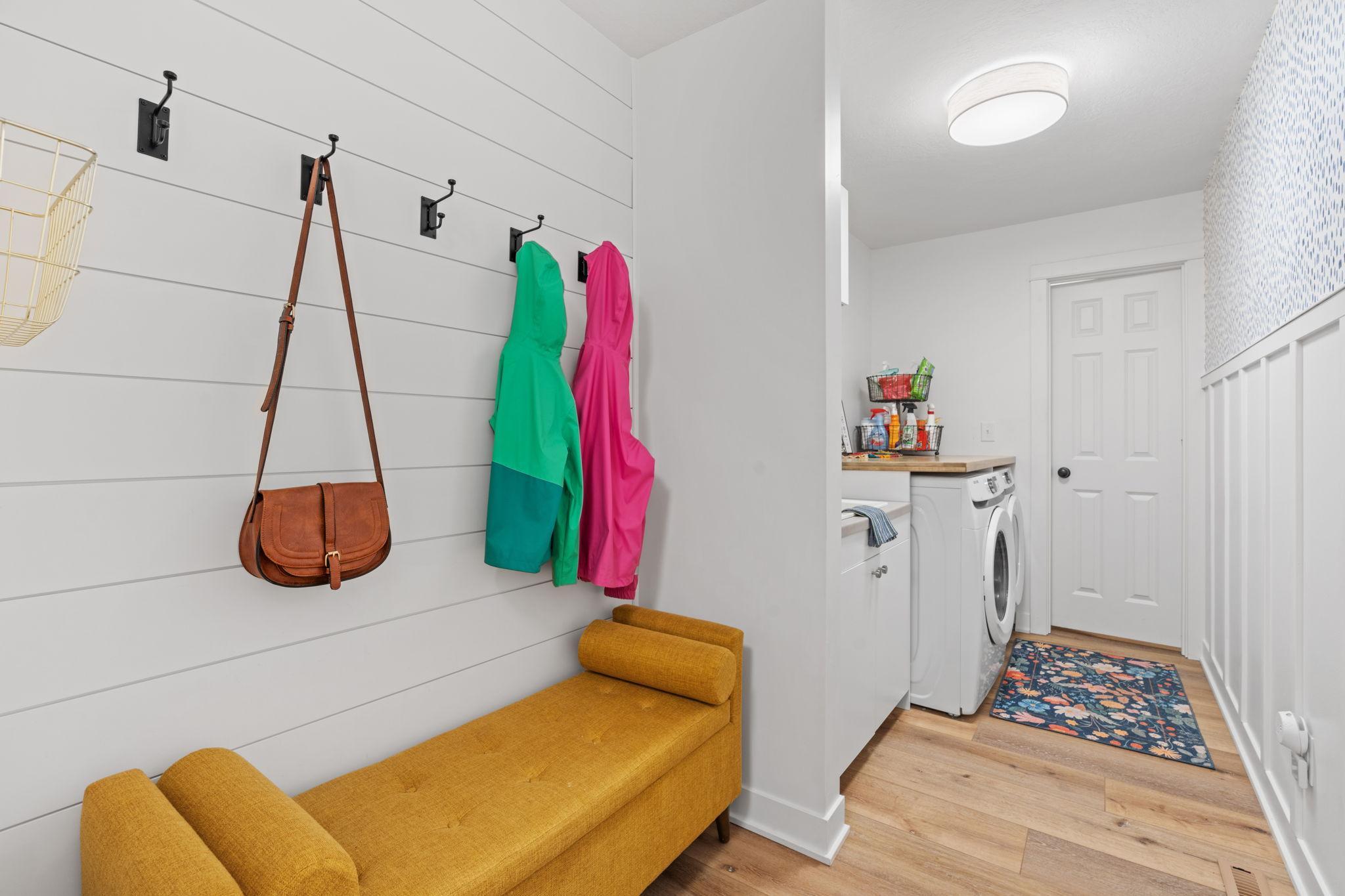 Extensive mudroom off the garage, complete with laundry and additional storage closet.jpg