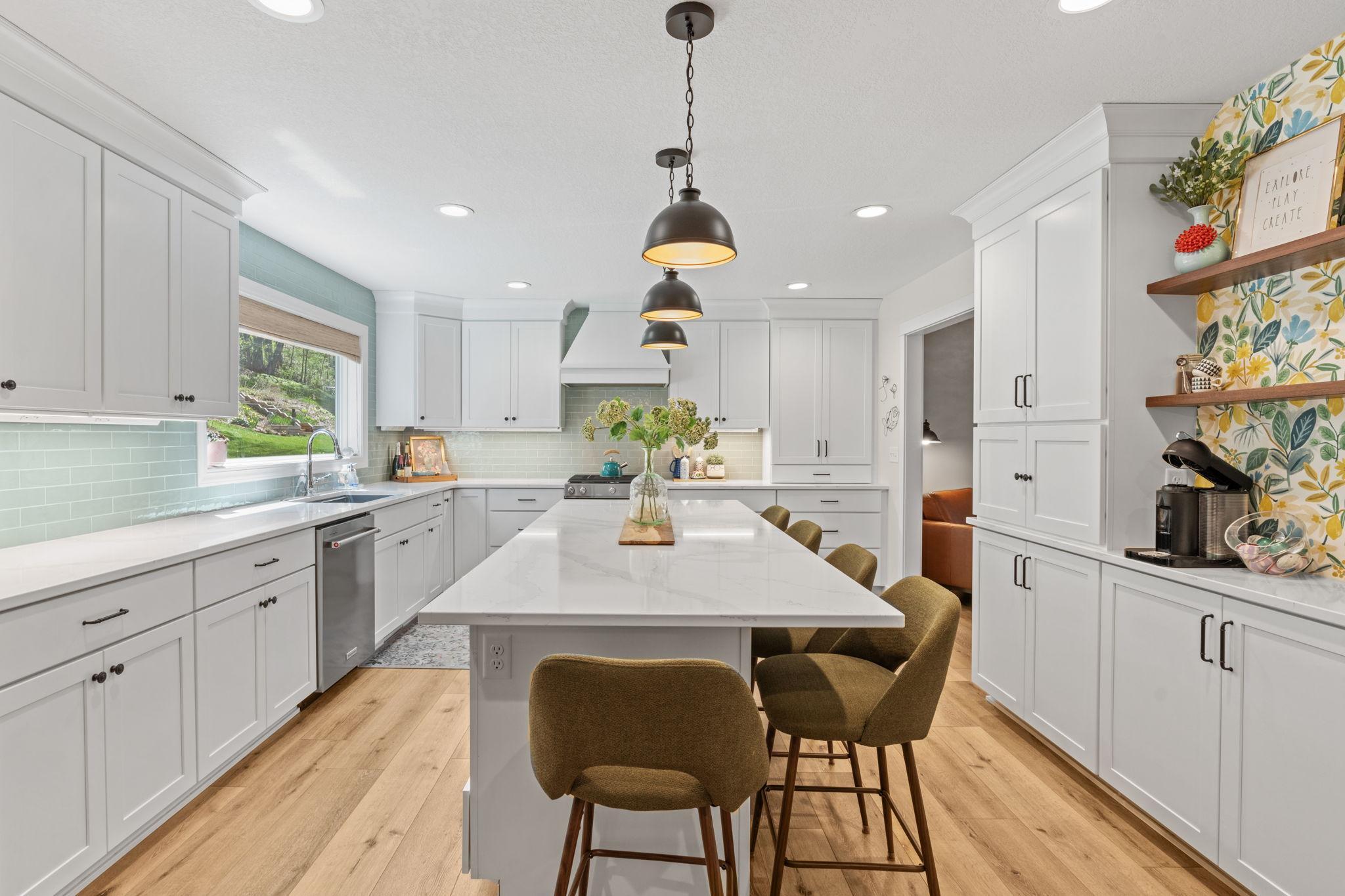 Renovated kitchen with new gas stove and exhaust hood