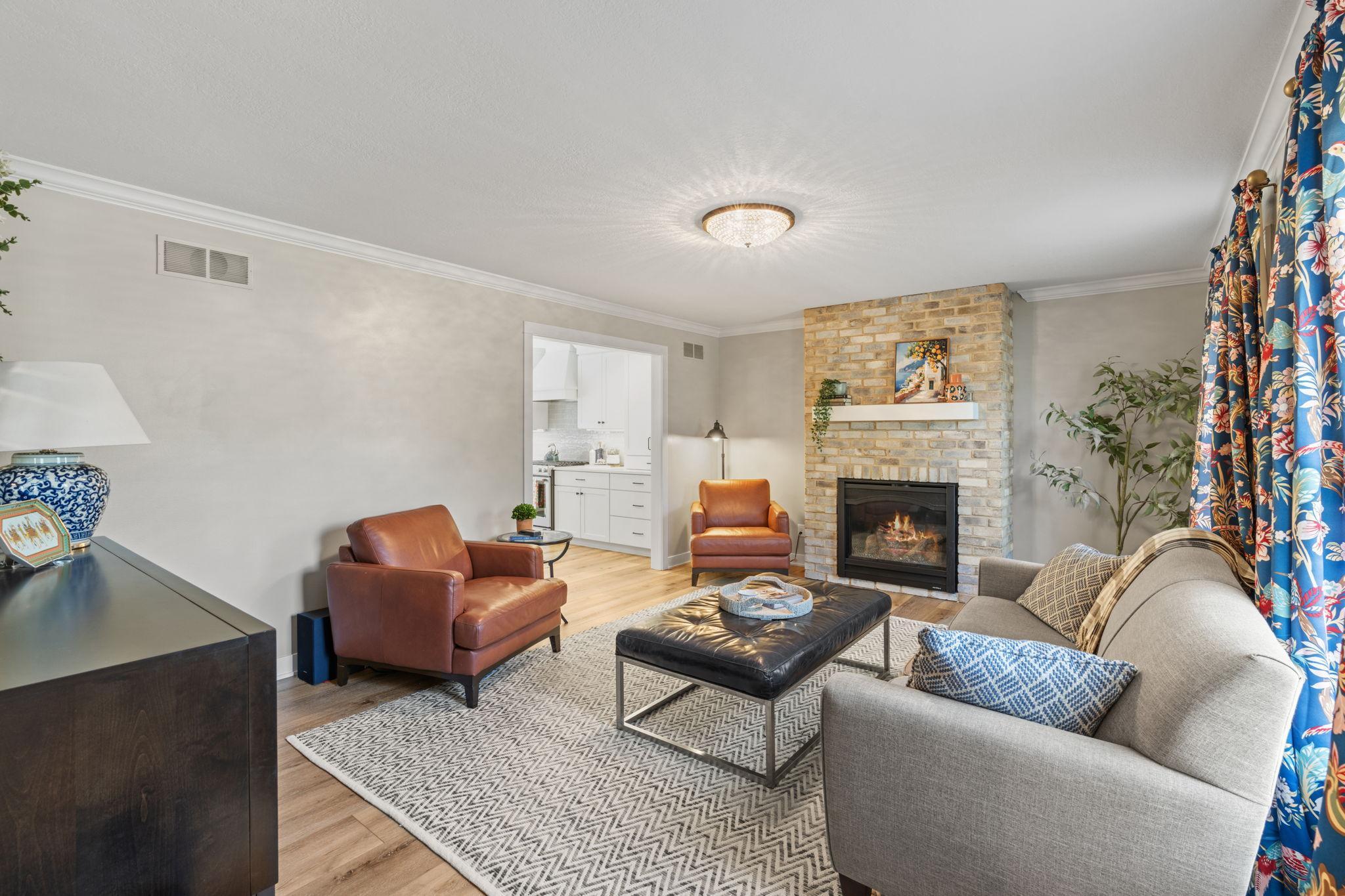 Spacious living room with a new gas burning fireplace