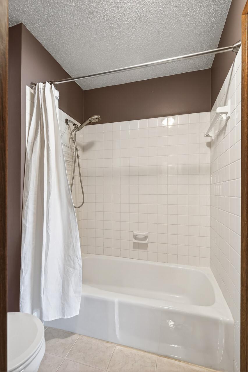 Impeccable ceramic surround tub/shower