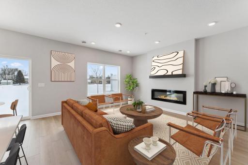 Living room features electric fireplace and blinds - for illustrative purposes only