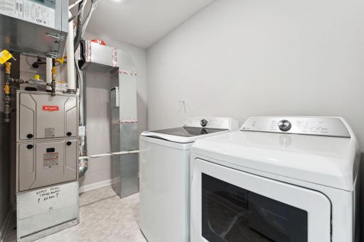 Laundry room features included GE washer and dryer - for illustrative purposes only