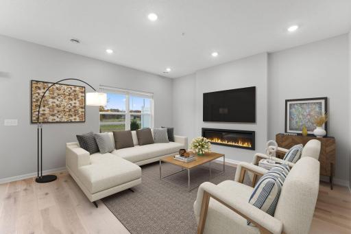 Living room includes electric fireplace and blinds - for illustrative purposes only