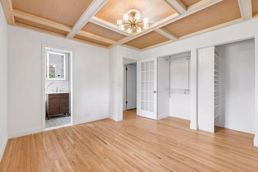 Primary bedroom with 2 closets and 3/4 private bathroom
