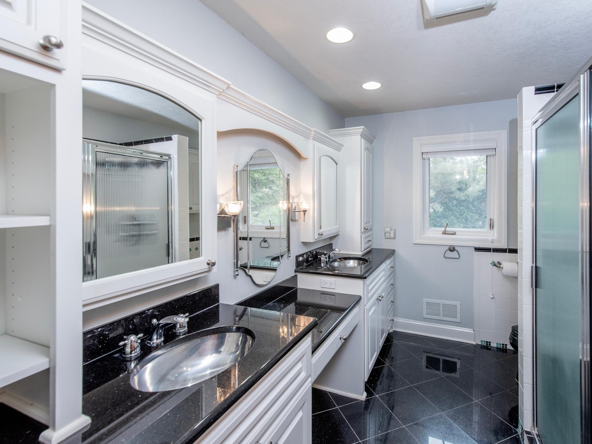 Upper level 3/4 bath with double sinks.