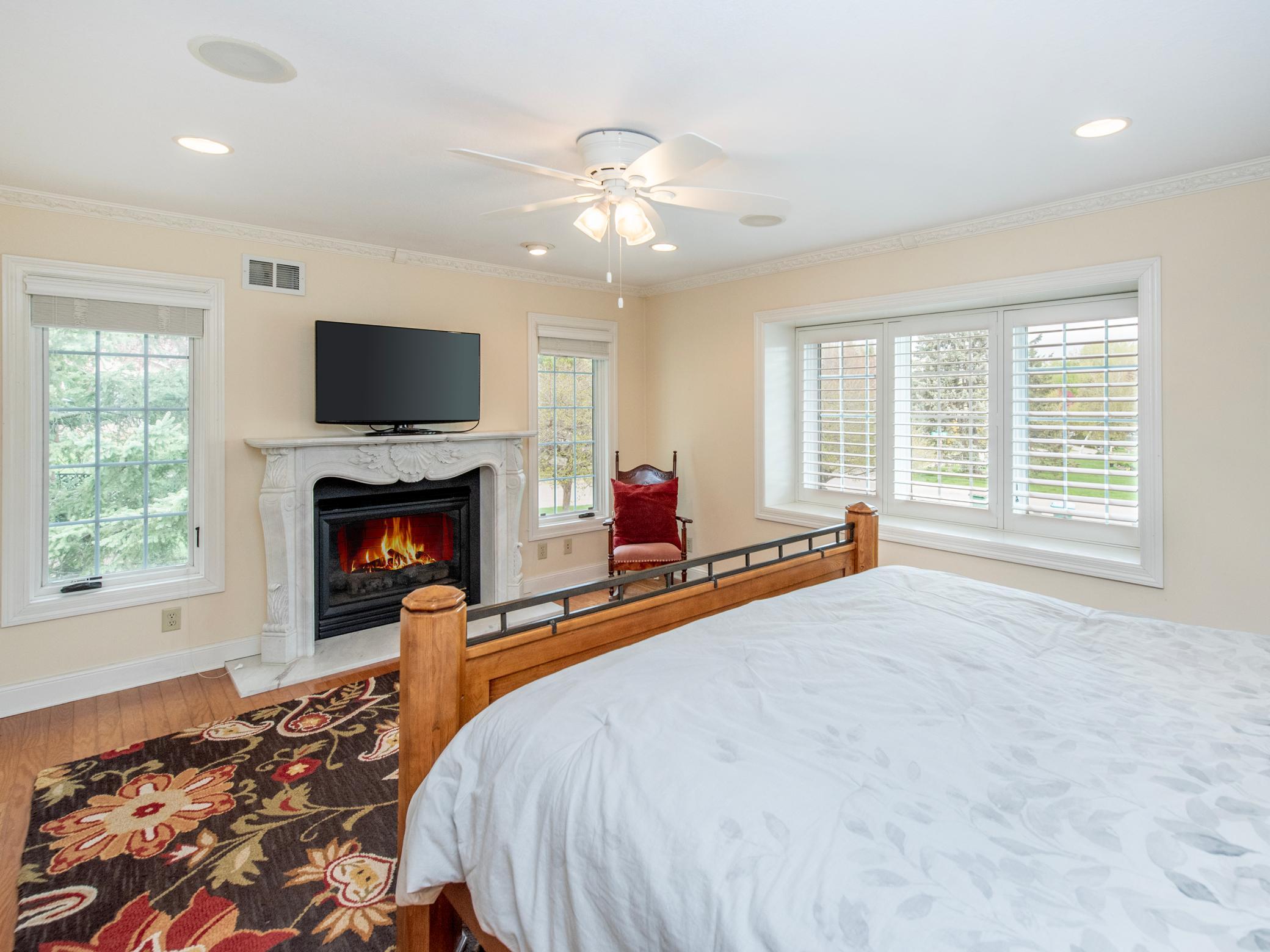 Primary bedroom with gas fireplace.