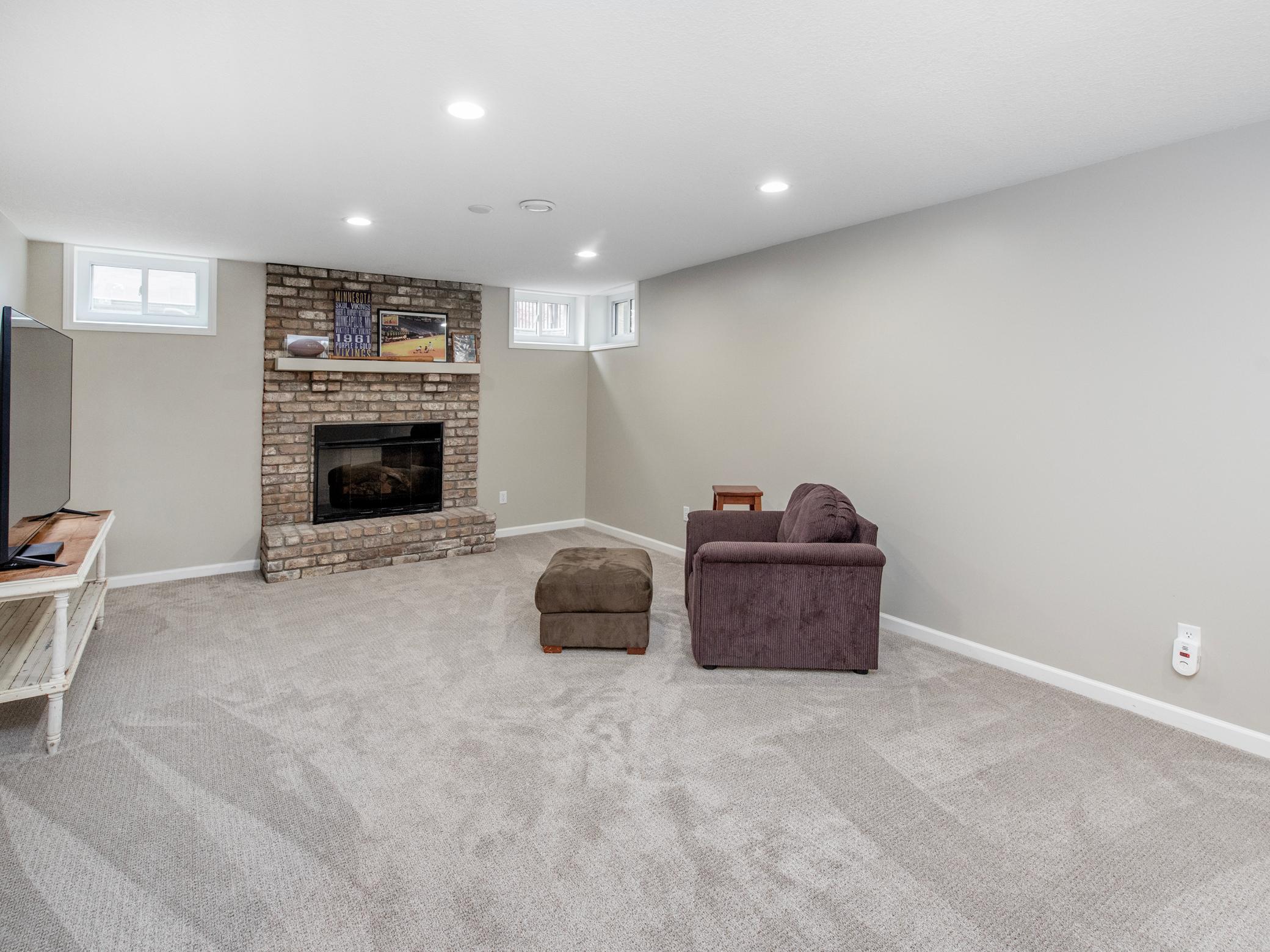 Lower level family room with fireplace.