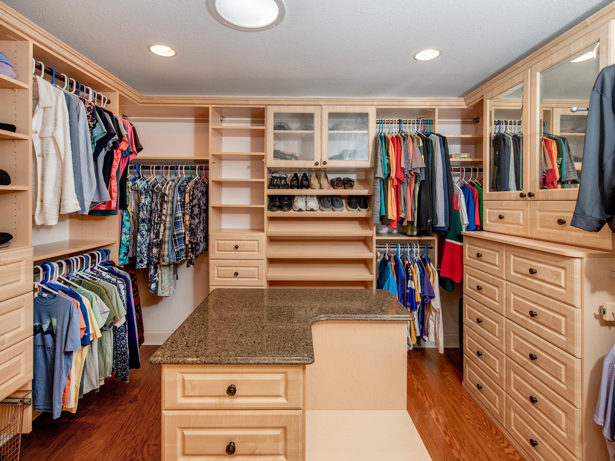 Amazing primary walk-in closet.