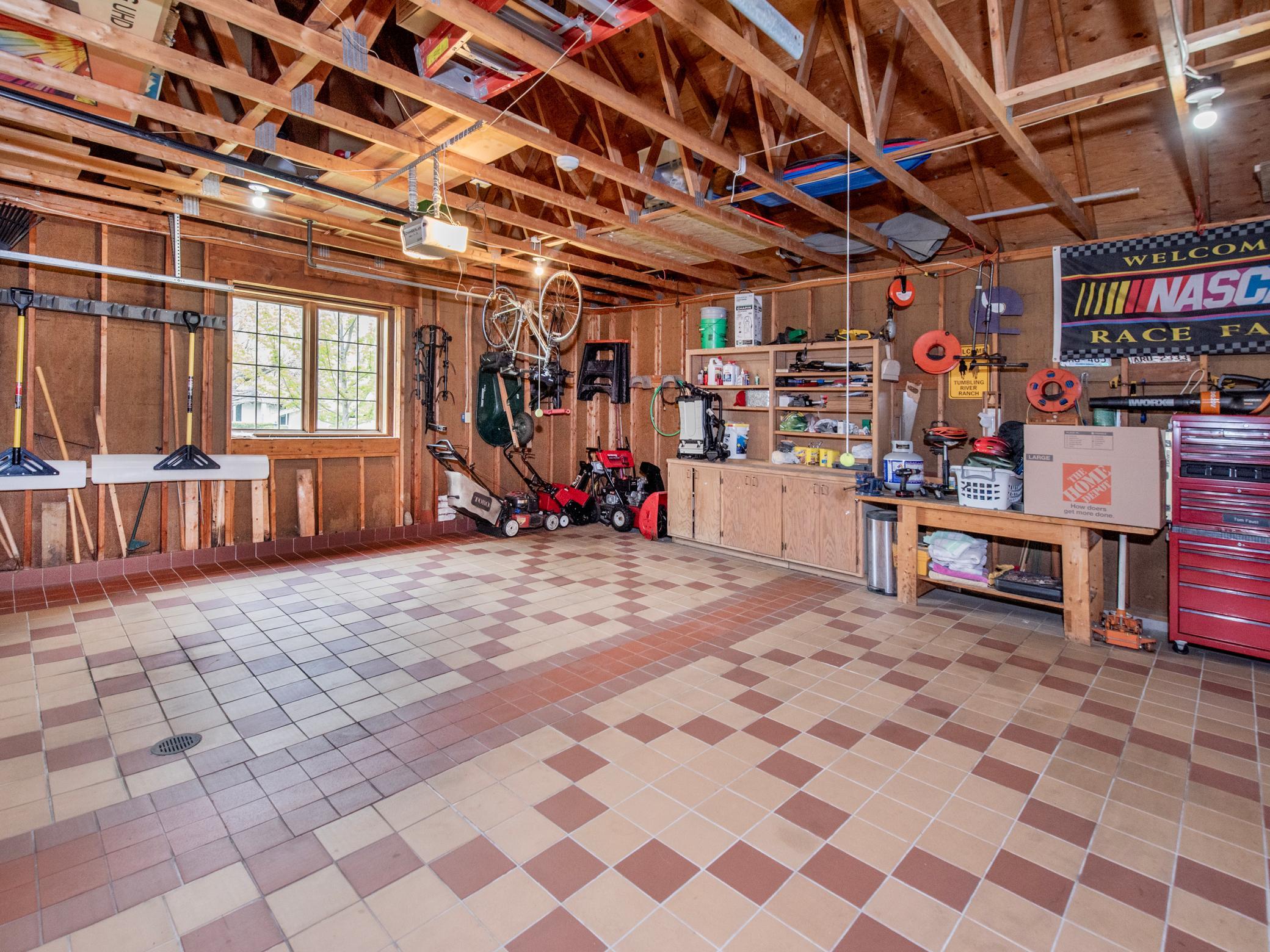 Oversized garage with tile flooring.