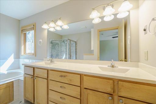 Primary dual vanity w/ marble countertop and integrated sinks