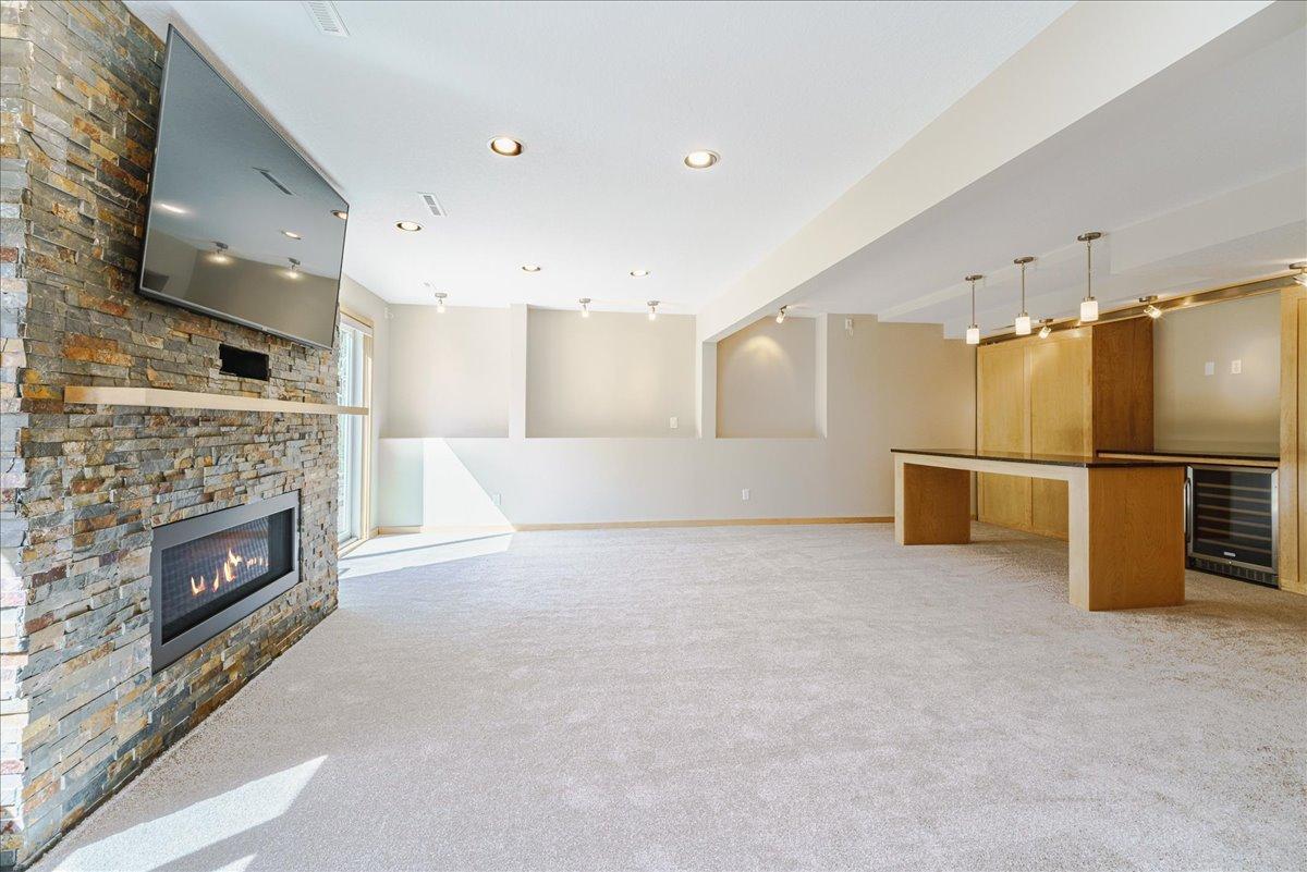 Knock down ceilings w/ a combination of recessed and accent lighting.