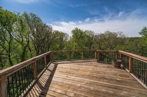 Enjoy the outdoors from the 2 decks, screened porch and paver patio w/ firepit, all surrounded by professionally landscaped perennial gardens and serene wooded views.
