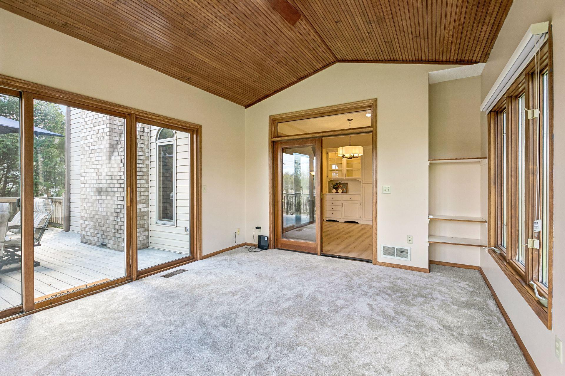 Main level sunroom opens to multi-level deck