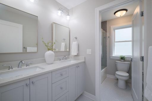 Every bath in this home delivers clean finishes, quality cabinetry, stone countertops, and natural light, making the secondary bath feel polished and complete.