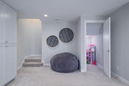 A dedicated play space kids will absolutely love! Port hole accent windows, plush carpet, and room to roam make this lower level bonus room one of the most delightful surprises.