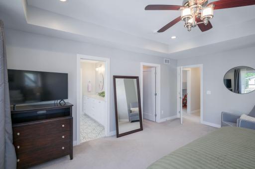 The primary suite layout delivers it all: a spacious walk-in closet and an en-suite bath entry tucked thoughtfully off the bedroom for maximum privacy and function.