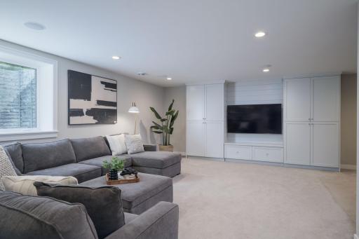 The lower level delivers even more living space. A generous family room with a built-in media wall, recessed lighting, and a room for the whole family to spread out and unwind.
