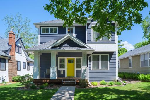 Summer canopy, navy exterior, yellow door. This home has the kind of street presence that makes buyers slow down, look twice, and fall in love before they ever step in.