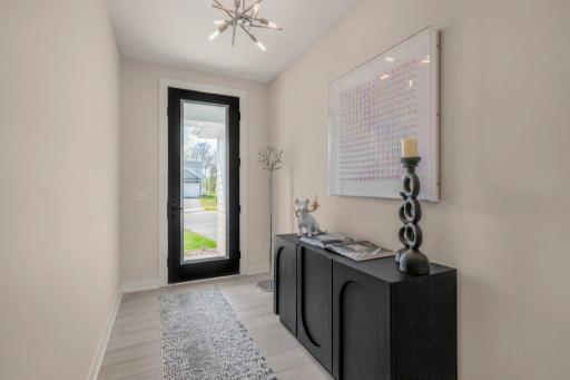 High end front door and finishes meet you as soon as you enter this lovely home.