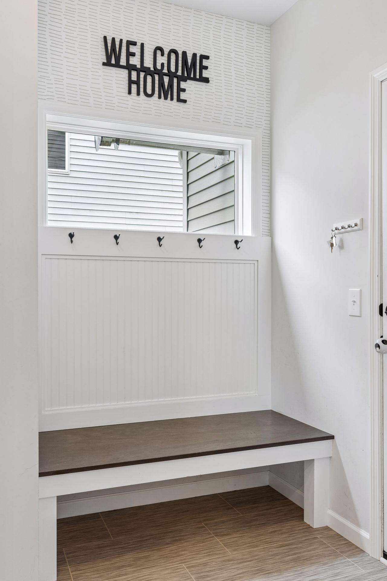 Built-in mudroom bench and hooks create the perfect everyday drop zone for coats, shoes, and backpacks.