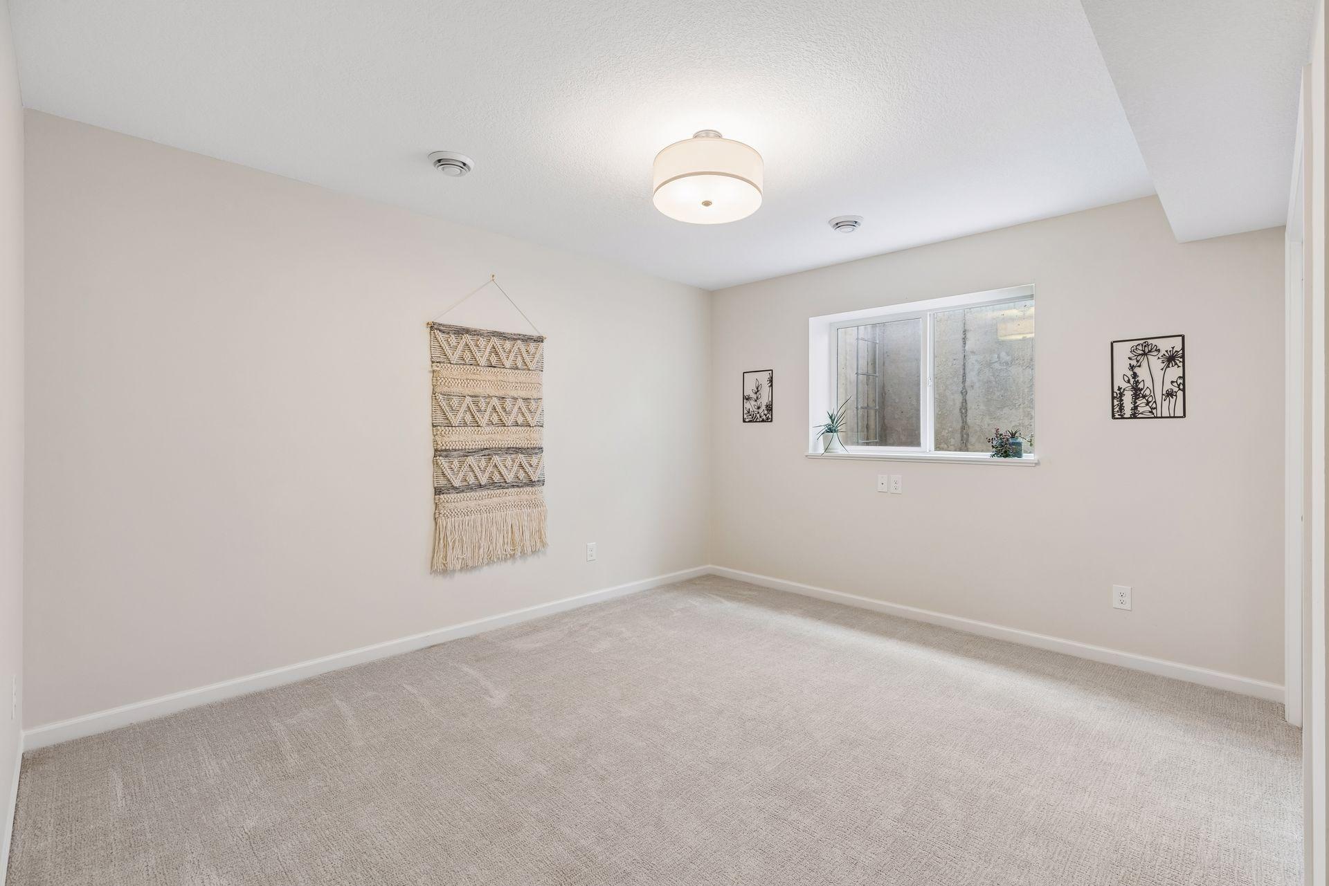 Spacious lower level bedroom with large closet and easy access to the nearby full bath.