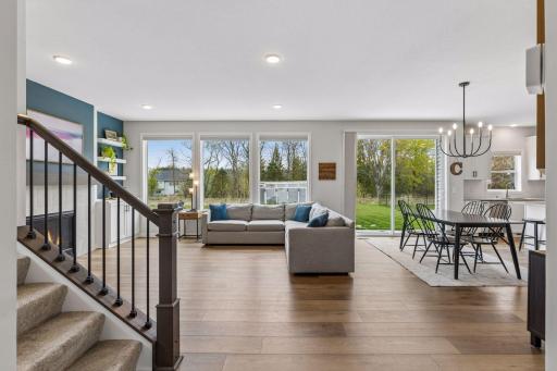 Open and airy floorplan filled with natural light and seamless flow between the living, dining, and kitchen spaces.