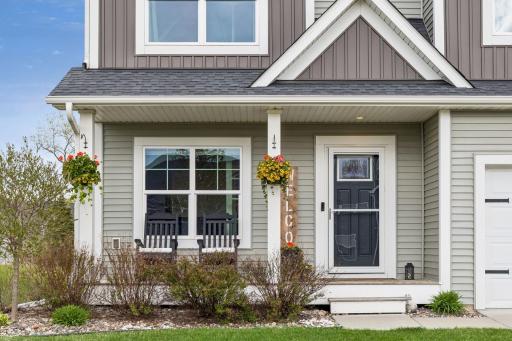 The welcoming front porch offers the perfect spot to relax and unwind outdoors.