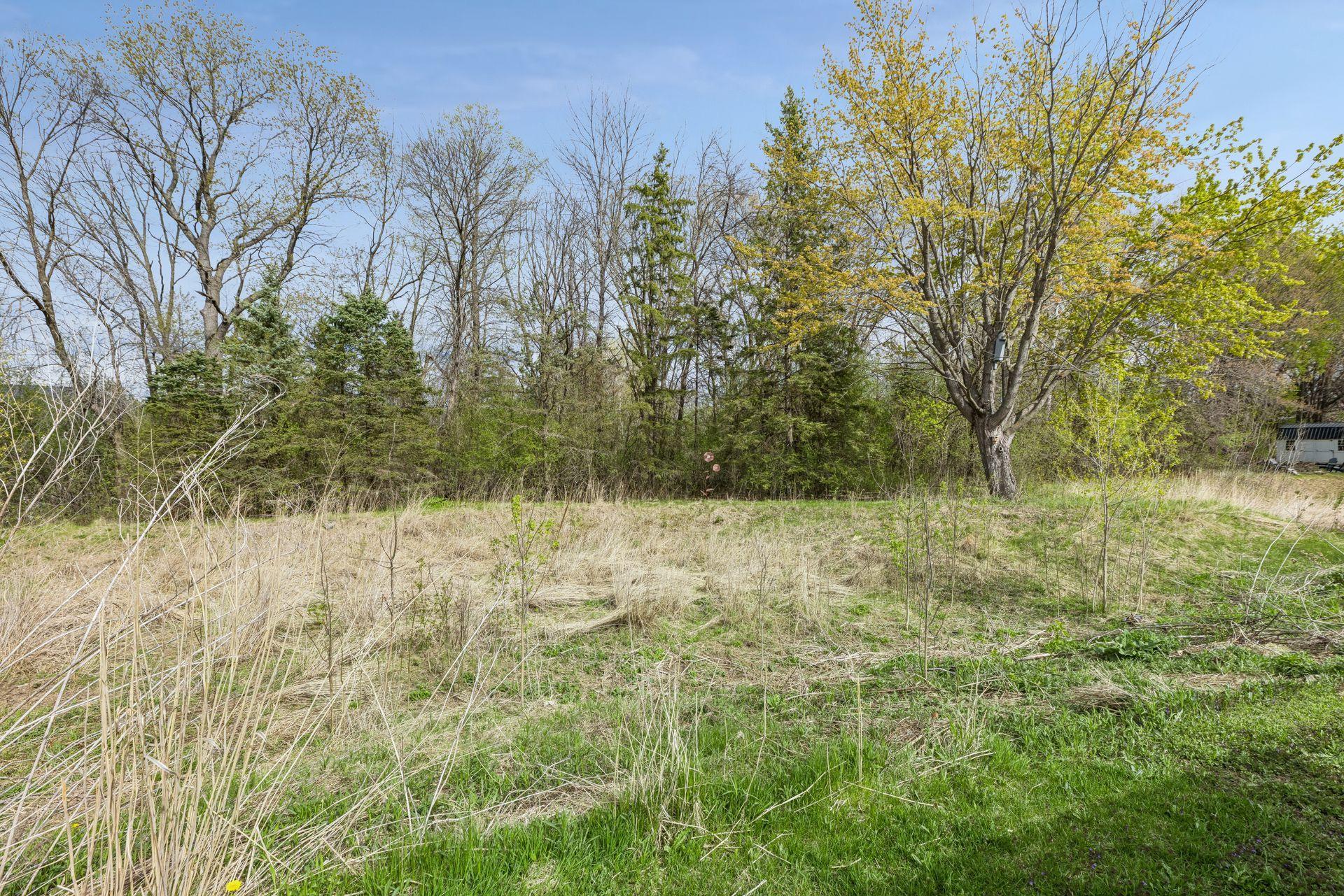 Wooded backdrop provides exceptional privacy and a peaceful natural setting rarely found!