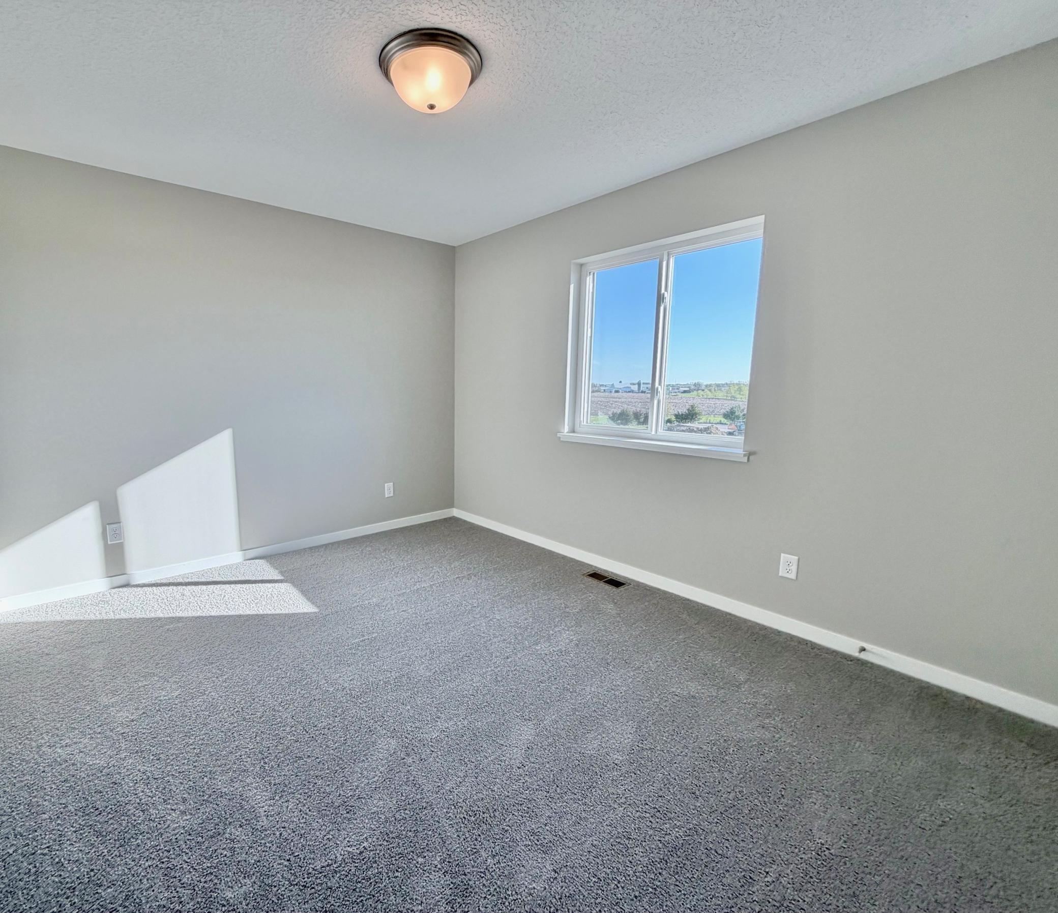 PHOTO OF A DIFFERENT HOME WITH SIMILAR PLAN. FINISHES MAY VARY. Bedroom 4 features a Walk-in Closet.