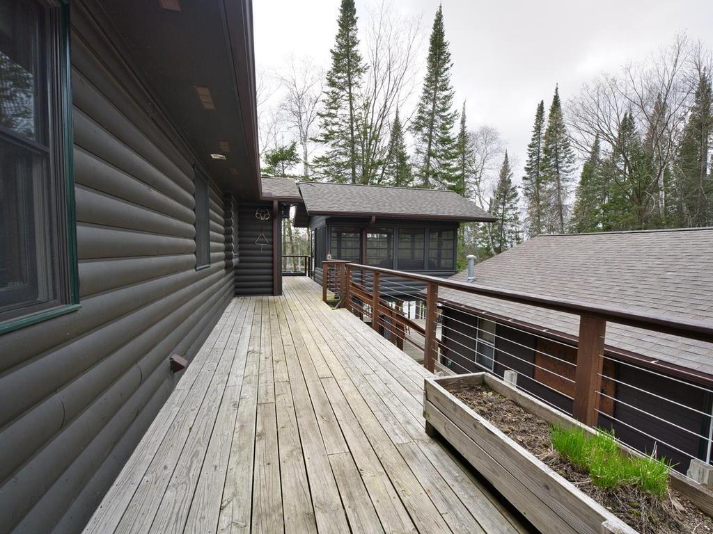 Wrap around deck with screened house