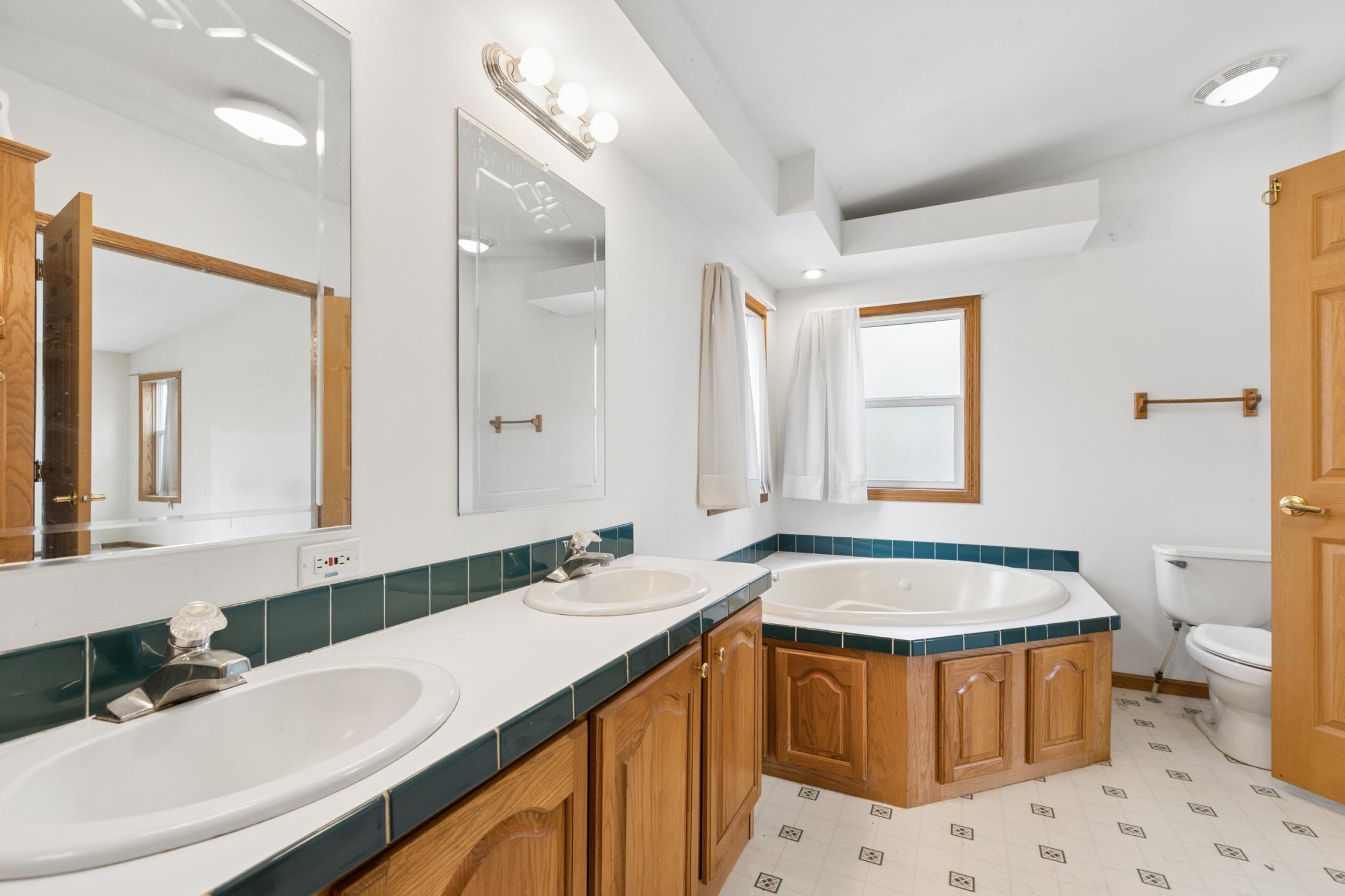 Large owner's suite bathroom with soaking tub, double sink and separate shower.