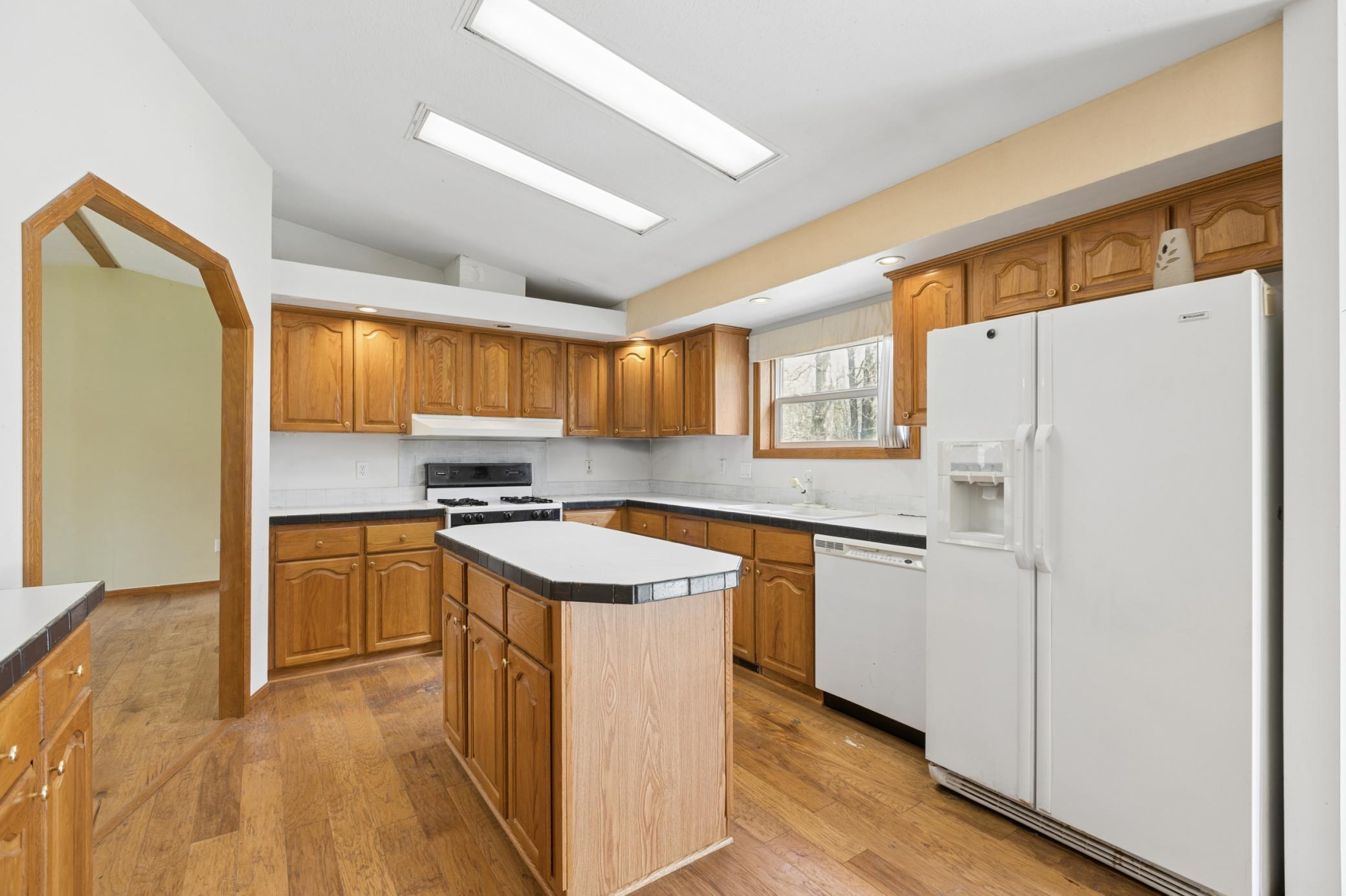 Spacious with plenty of cabinets and a built in wall pantry.