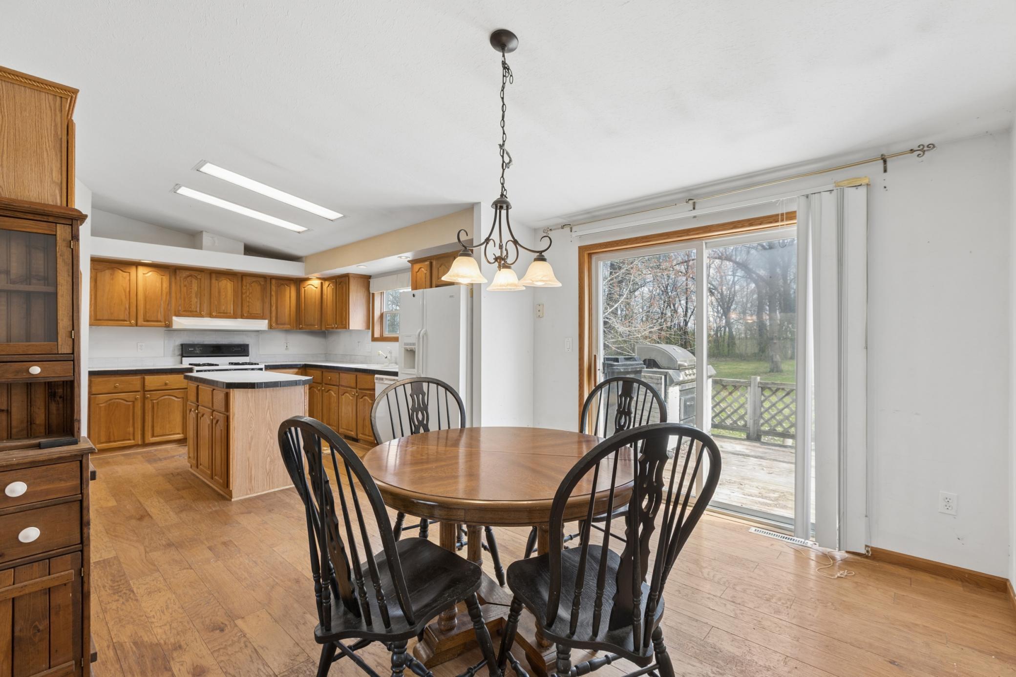 Spacious kitchen/informal dining lead to the deck off the back.