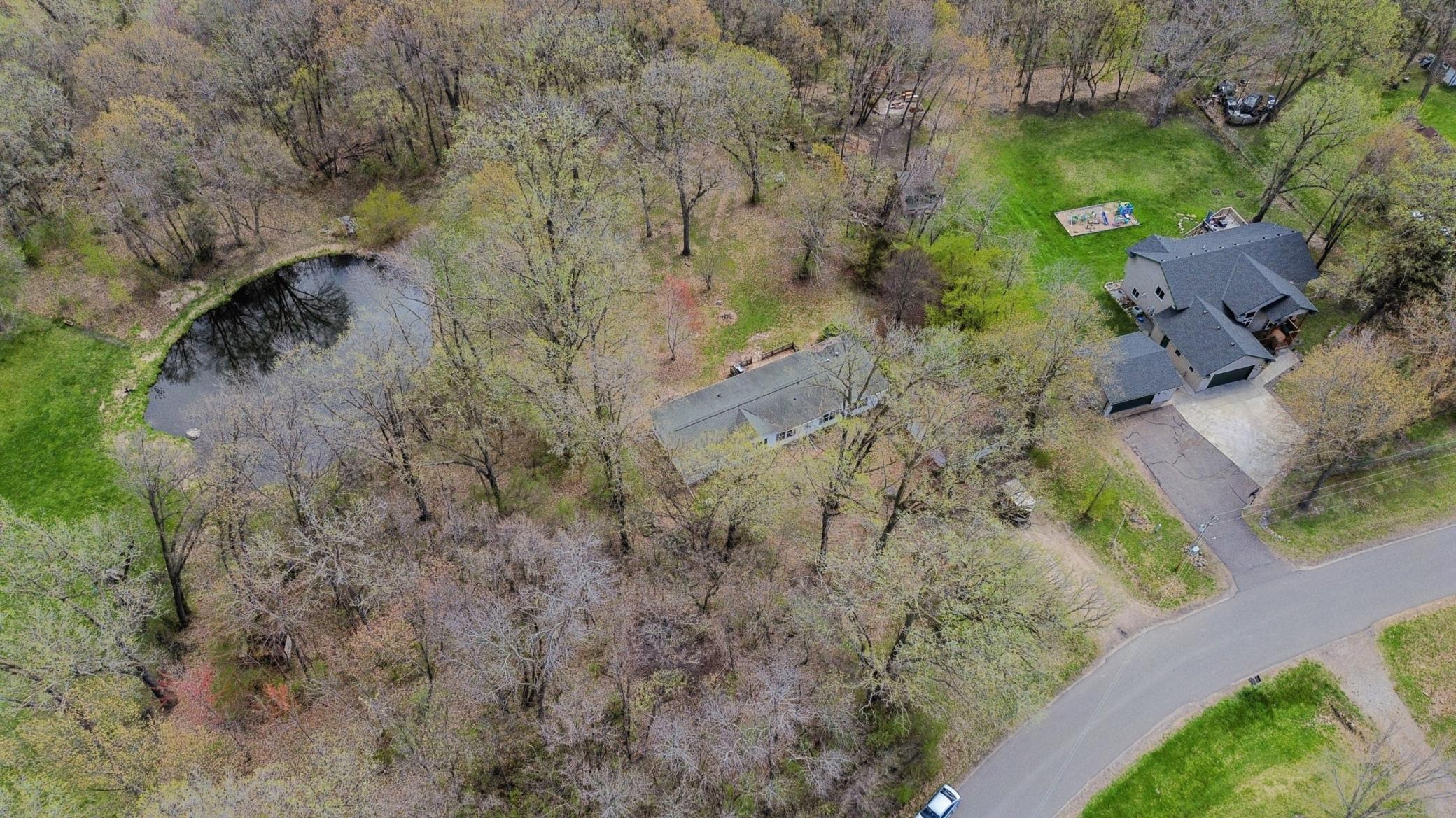 Gorgeous private views overlooking the pond from the backyard, decks, and windows of this home.