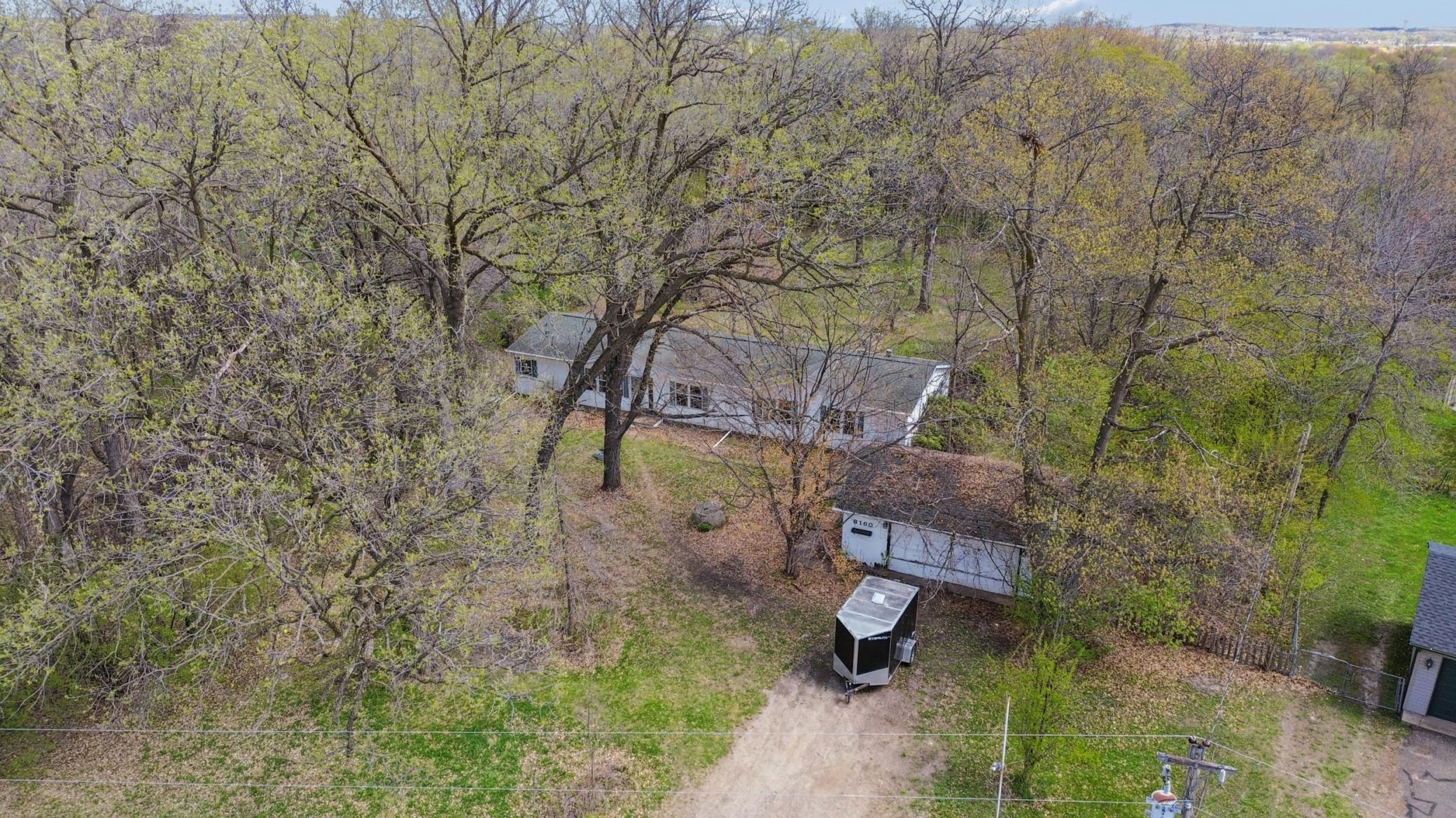 Unique 1999 built manufactured home nestled on 1.3 acres of picturesque land in the heart of Otsego.