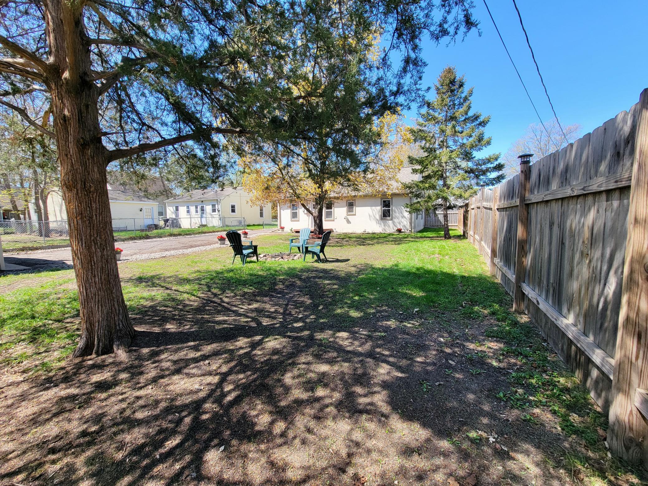 A view from the far back of the yard by the garden