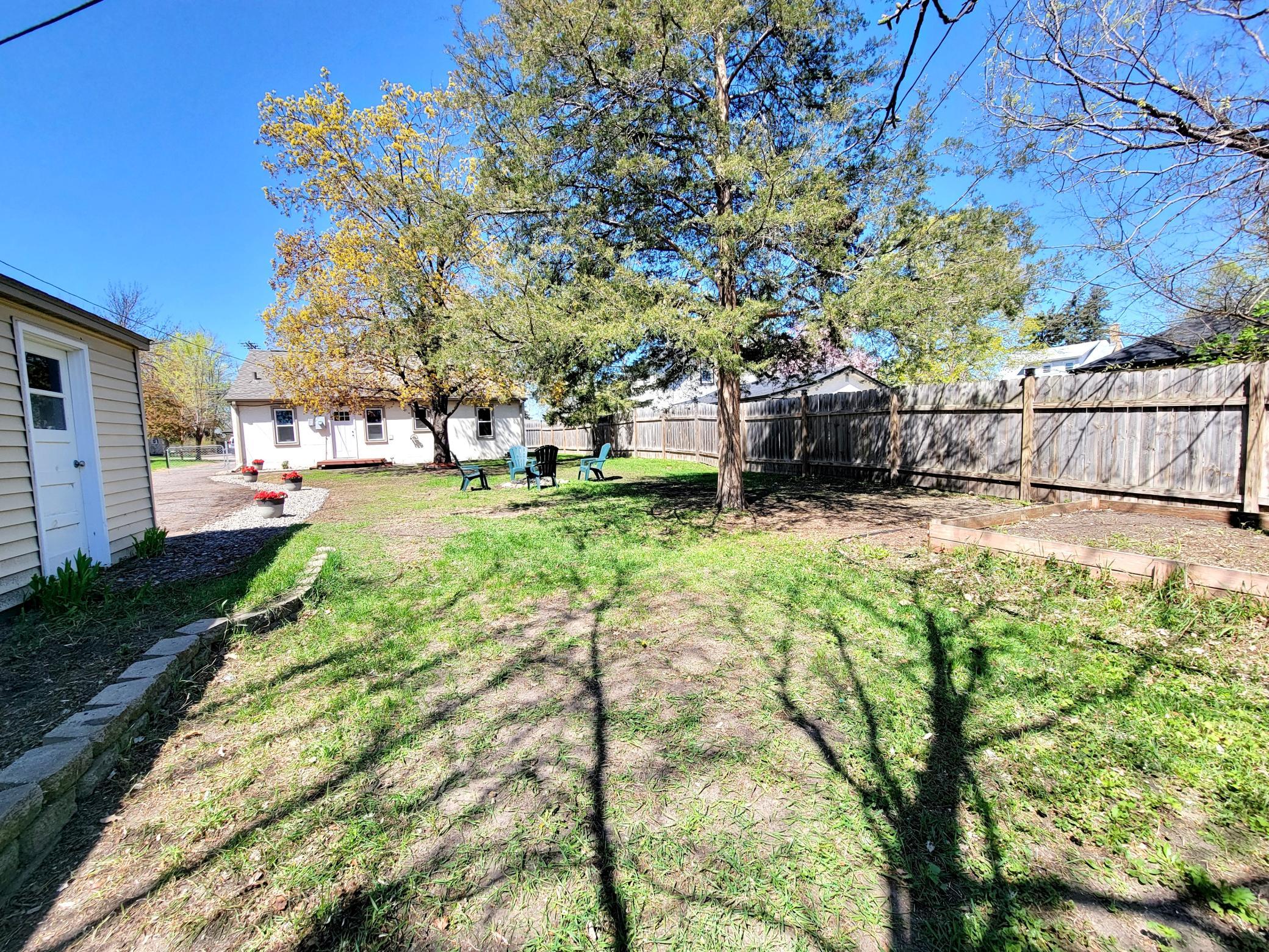 A view of the yard from the back of the garage