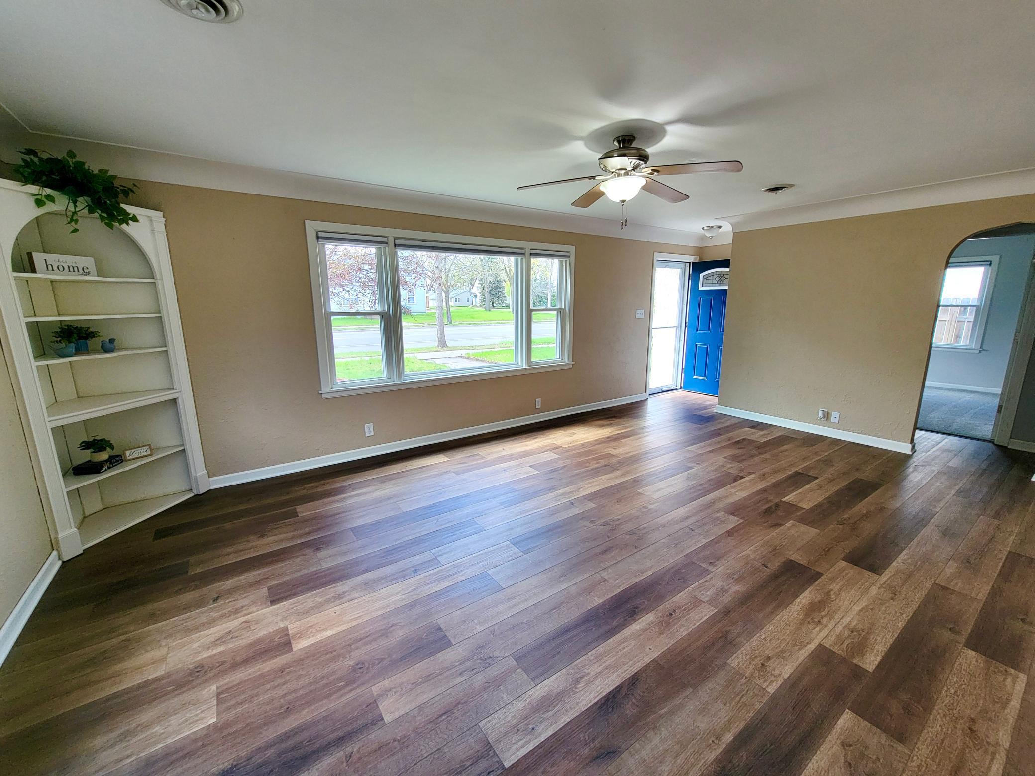 Huge living room with new LVP flooring and newer windows
