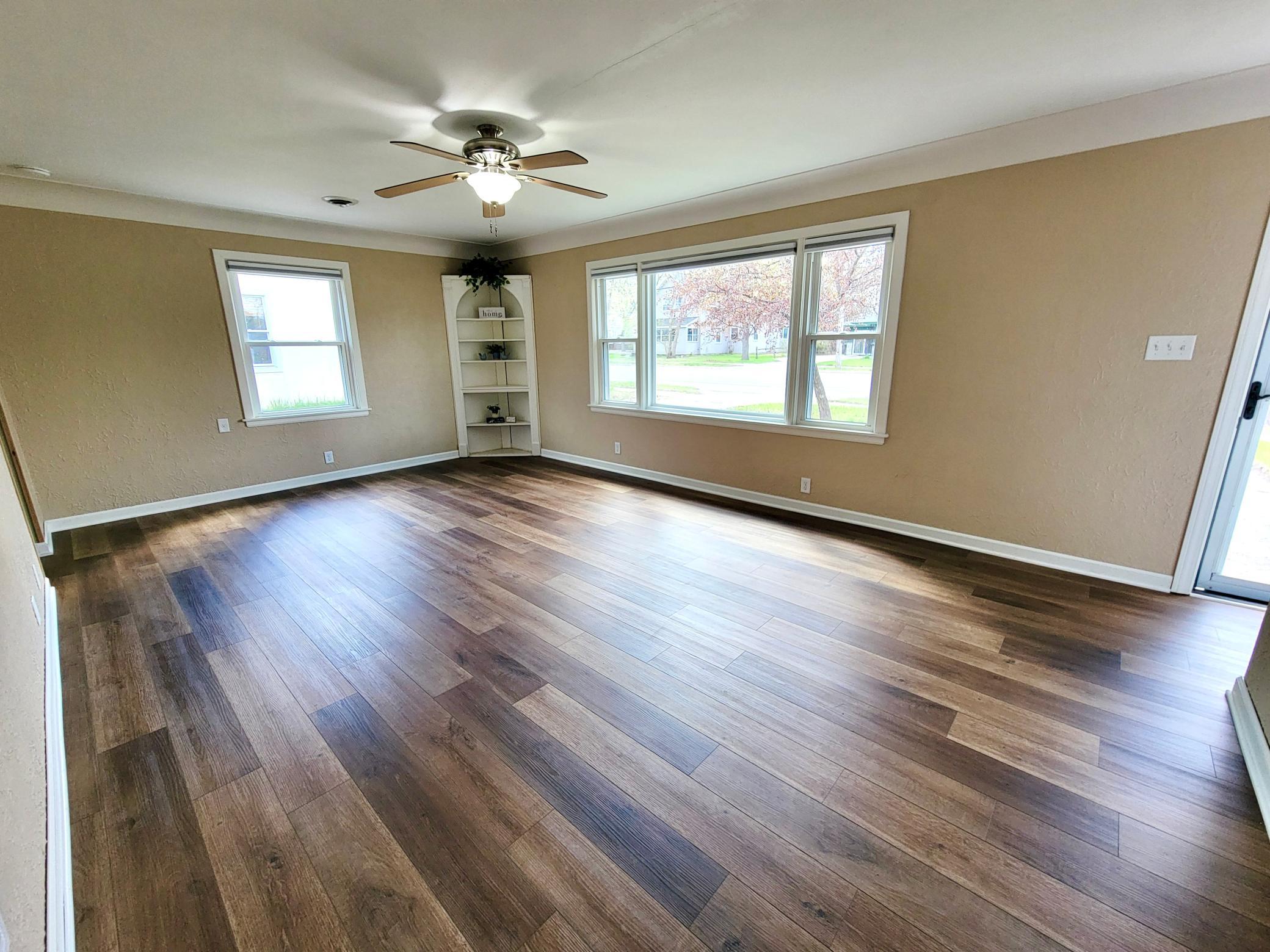 Spacious room shows the built-in hutch with room to place your dining table in front of the far window as typical when the house was built
