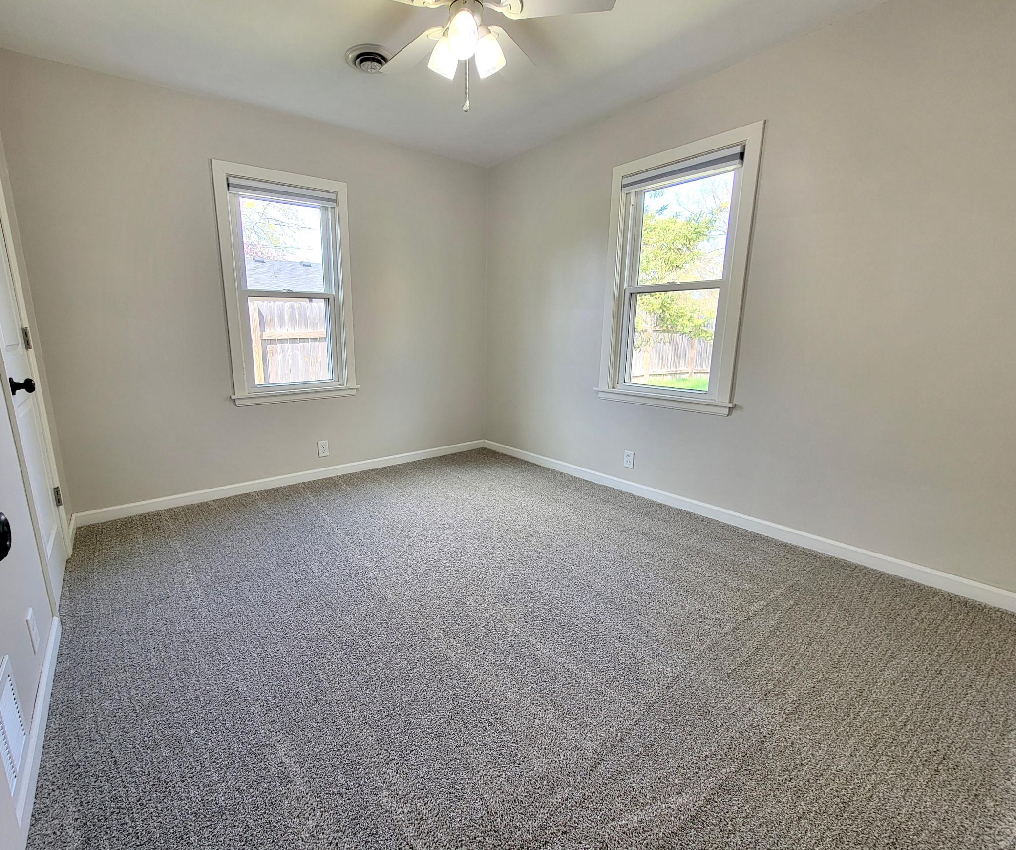 One of two bedrooms, both with brand new carpet (April 2026)